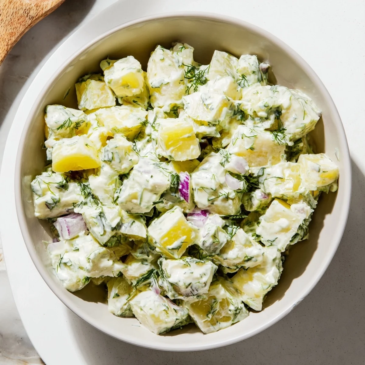 Refreshing potato salad inspired by a margarita, featuring pickles and vibrant herbs.