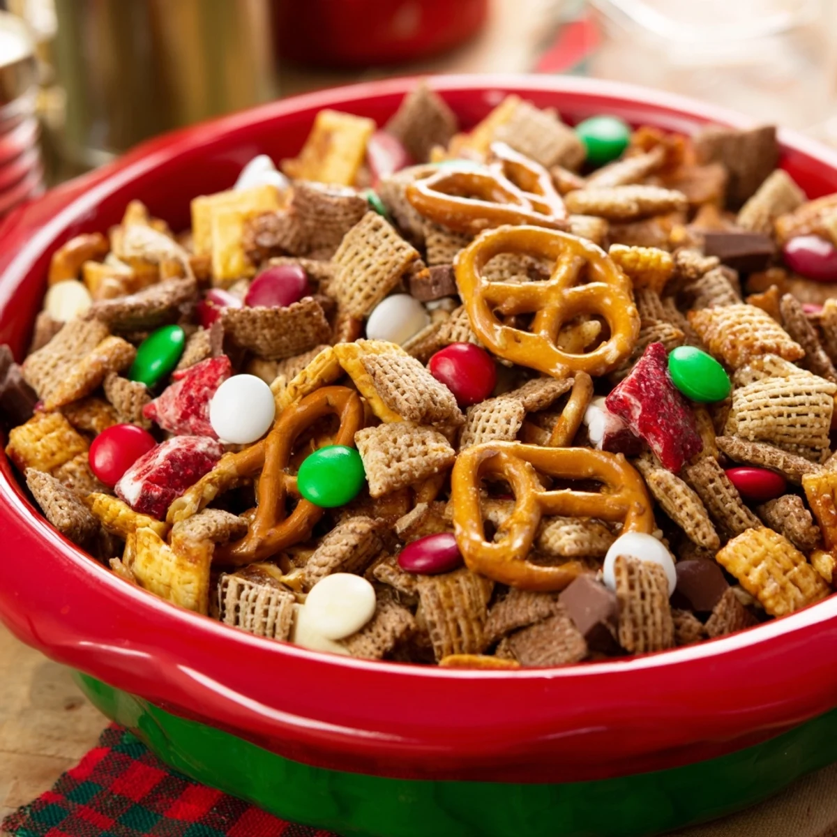 A bowl overflowing with savory and sweet Holiday Mix; ready for a snack or holiday party.