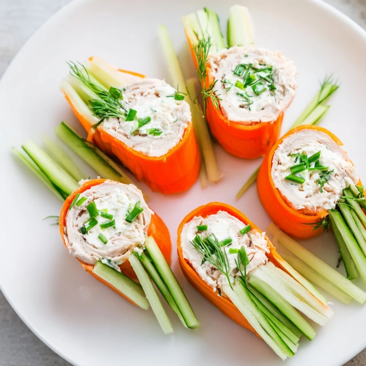 Vibrant, colorful "Ribbon Dancer" appetizer; carrot and cucumber ribbons wrap smoked turkey rolls.