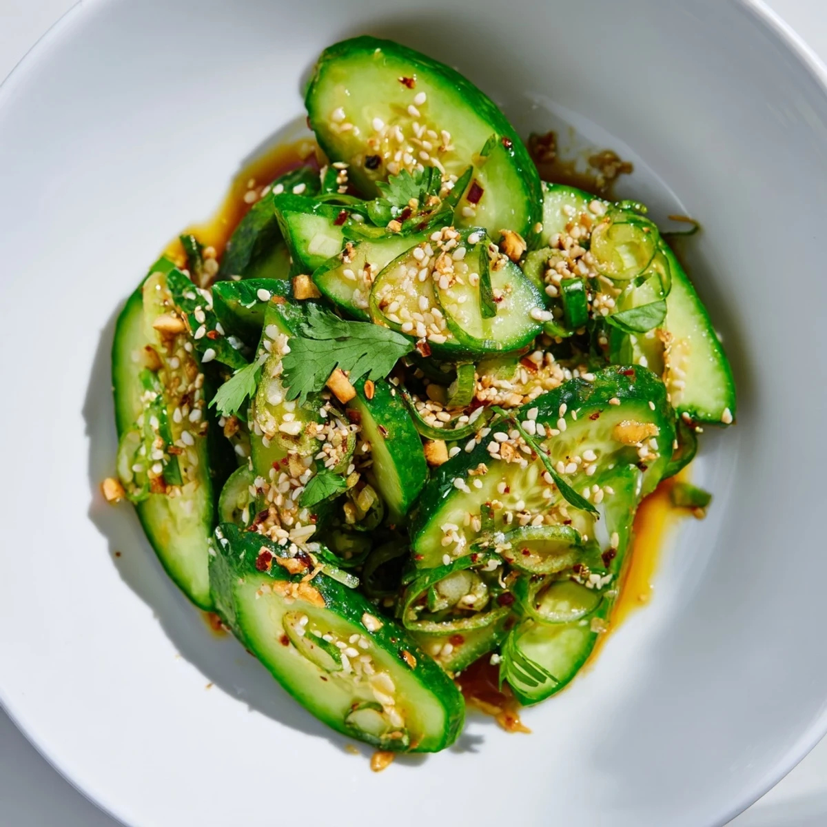 Fresh Zesty Shake Cucumber Salad with sesame seeds, cilantro, ready to serve after chilling.