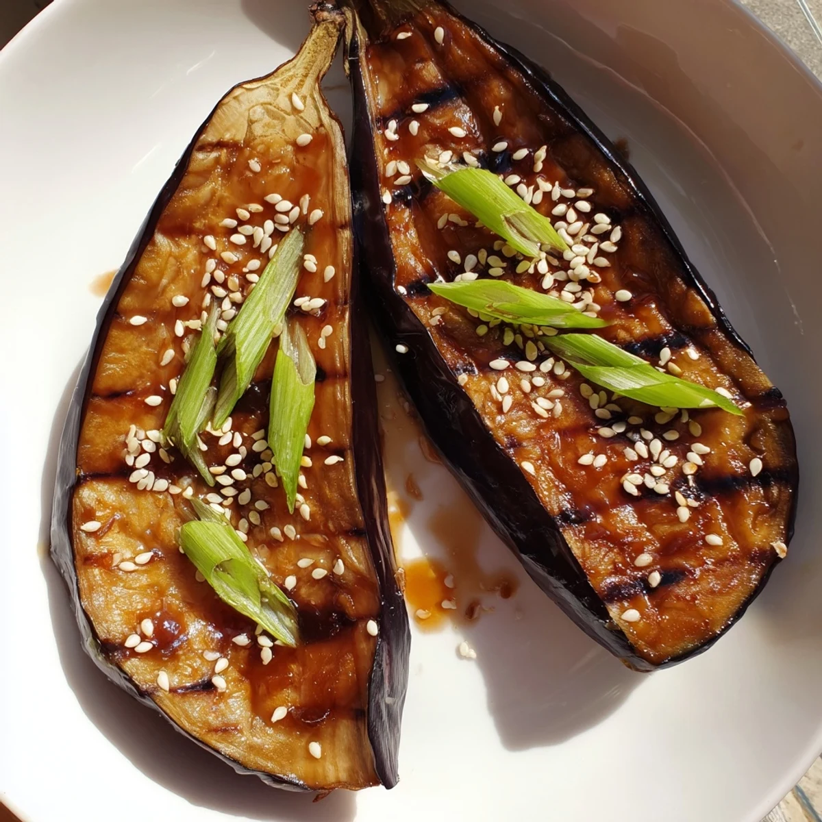 Golden-baked Miso Glazed Eggplant halves with caramelized edges and a glossy glaze.