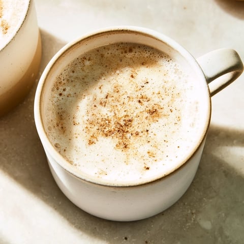 Express Nutmeg Hot Milk steaming gently in a cozy mug, promising a warm, spiced beverage experience.