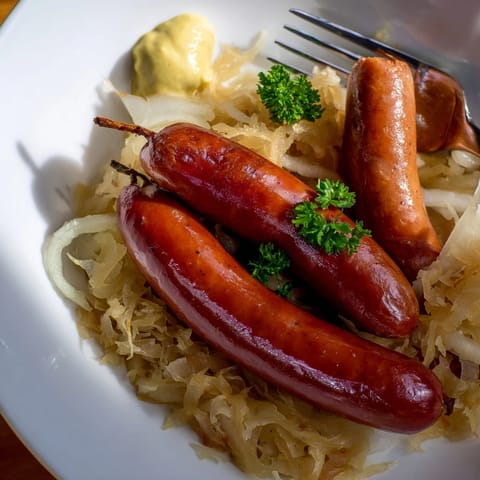 Oktoberfest Knackwurst & Sauerkraut: Smoked sausages simmered in tangy sauerkraut with apples and onions.