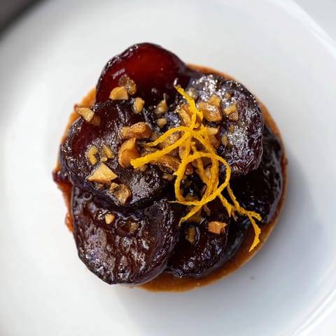 Warm, spiced Express Prune Compote Tartlets ready to serve, a truly decadent dessert.