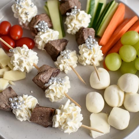 Delightful Fluffy Clouds Lamb Baby Shower Board: an artistic grazing board with colorful veggies and lamb.
