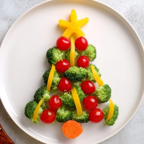 A colorful Broccoli Tree, adorned with bright cherry tomatoes, ready to serve as a tasty appetizer.