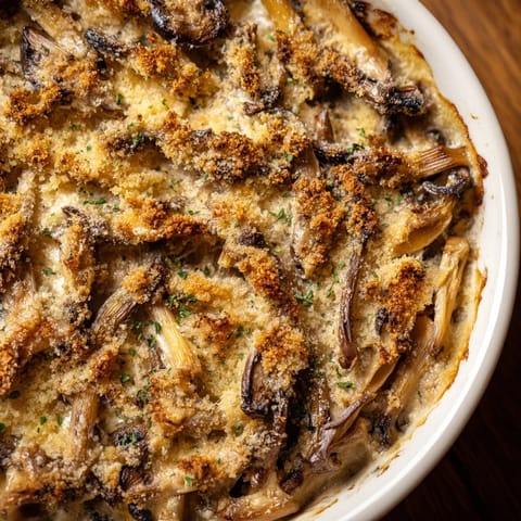 Close-up of golden brown Ranch-Seasoned Crispy Mushrooms, perfectly seasoned and baked for a snack.