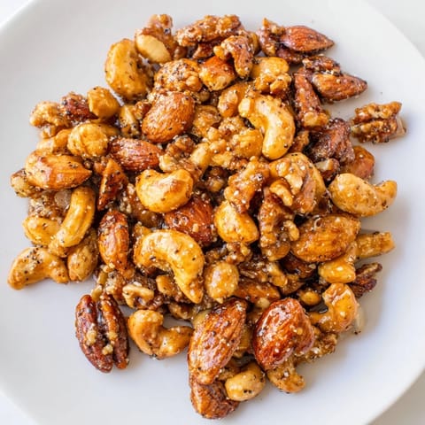 Golden, aromatic spiced nuts mix, perfect for a gluten-free snack alongside a cheese board.