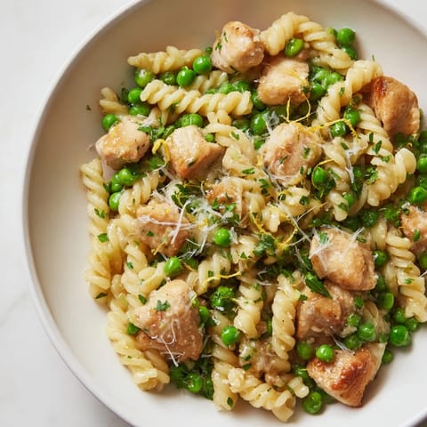 Creamy Garlic Butter Chicken & Pea Pasta, perfect for a quick weeknight dinner, ready in 35 minutes!