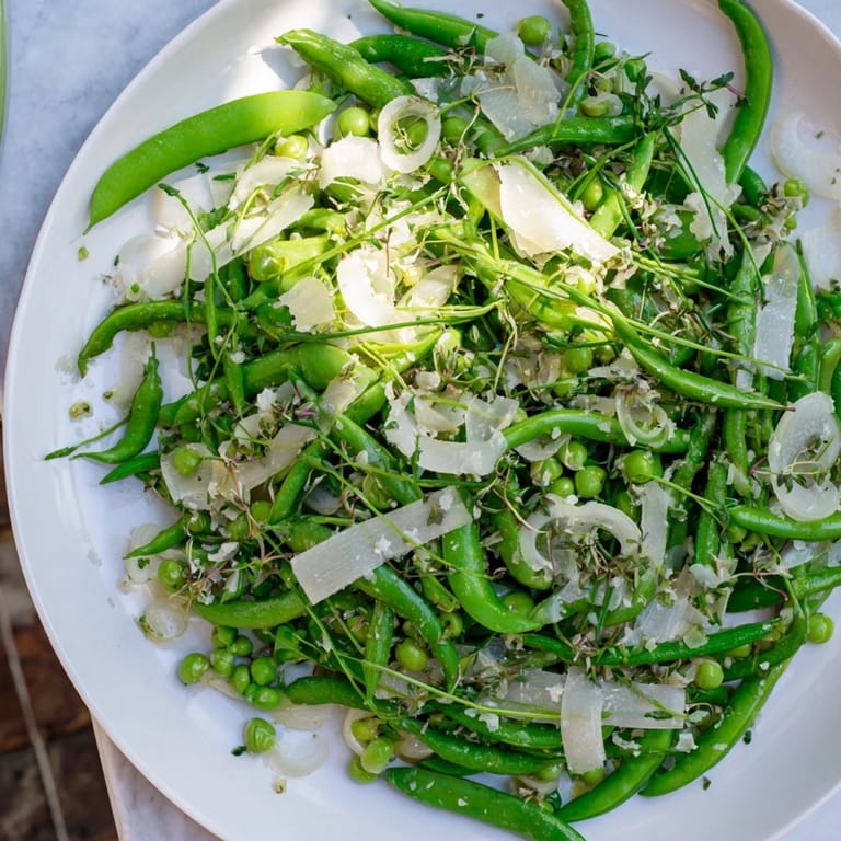 A visually stunning The English Ivy salad, featuring green snap peas and white cheddar, tossed in a light dressing.