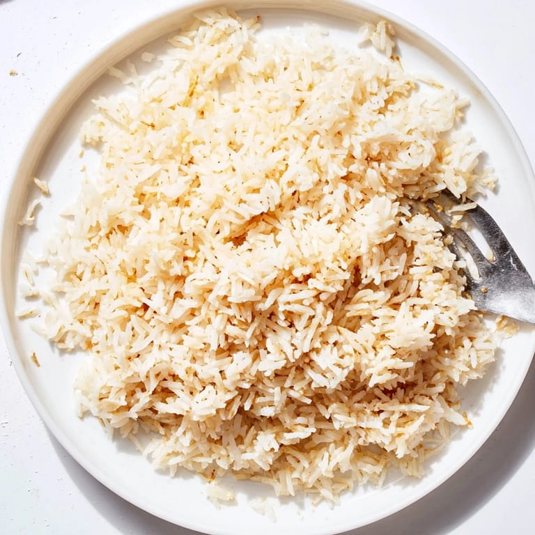 Steaming coconut jasmine rice with a delicate sweetness, ideal alongside your favorite curry dish.