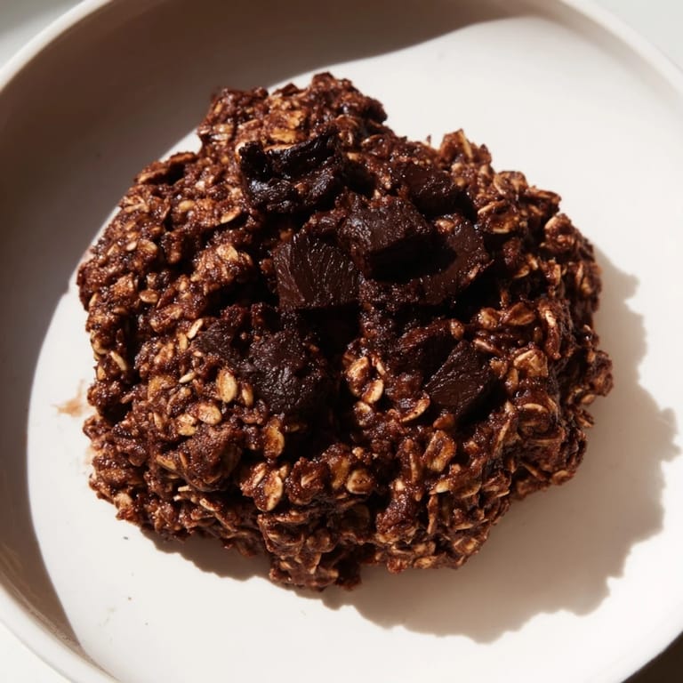 *   Golden-brown chocolate oatmeal breakfast cookies on a baking sheet, ready for a comforting breakfast or snack.